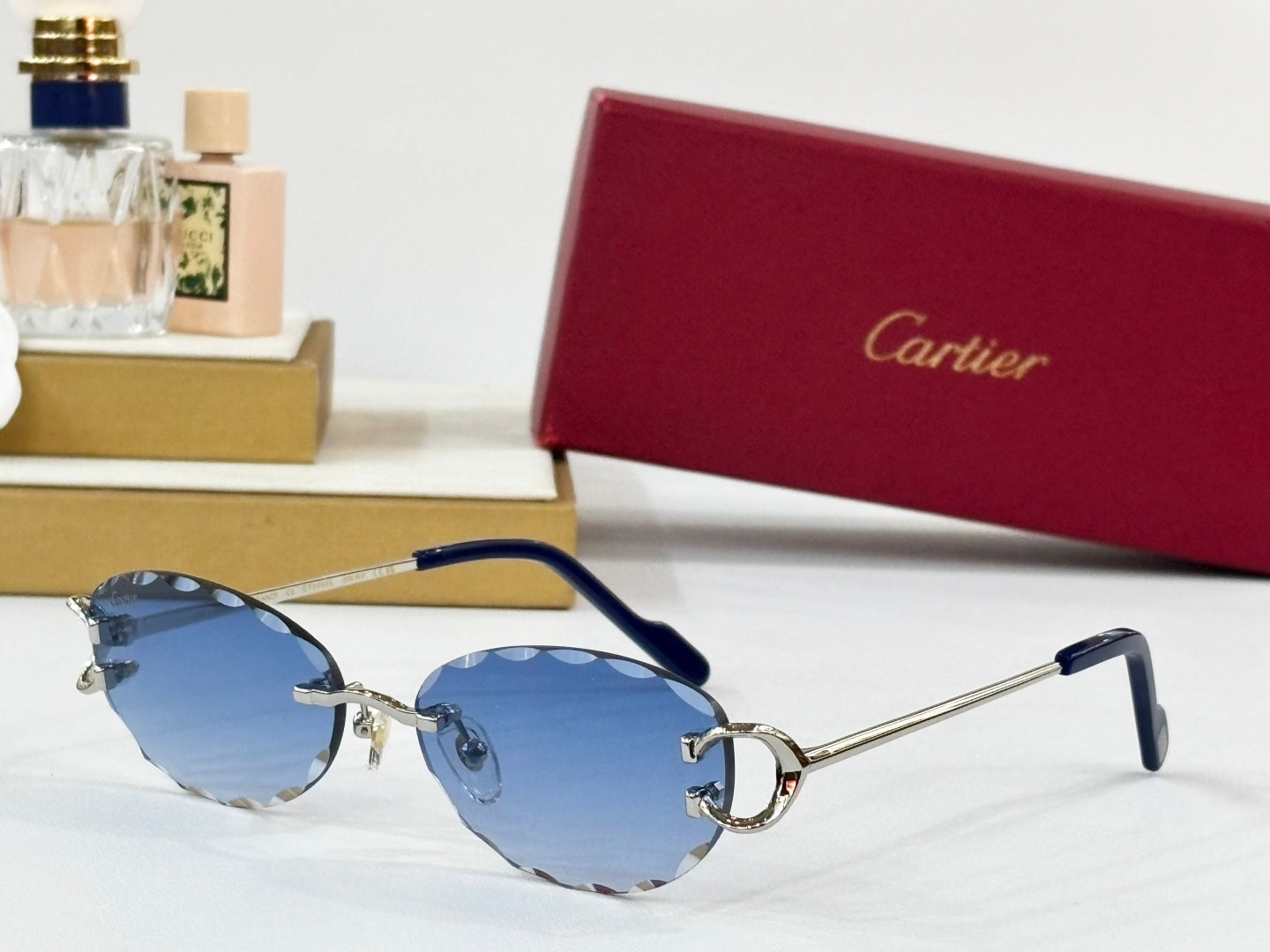 C DE RIMLESS ROUND FRAME SUNGLASSES CT0599S IN METAL